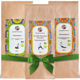 Bio Kräutertee und Grüntee Probierpaket Sunrise to Sunset: Drei Premium-Tees von Qidosha, in braunen Tüten mit grünem Band, ohne Füll- oder Zusatzstoffe.