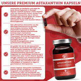 Premium Astaxanthin 12 mg plus Olivenöl Softgels von QIDOSHA, vegan und ohne Zusatzstoffe. Hand hält Gelkapsel, Glasbehälter mit 90 Kapseln, hohe Bioverfügbarkeit.